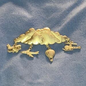 Vintage JJ Stamped Gold Cloud and Travel Charms Brooch